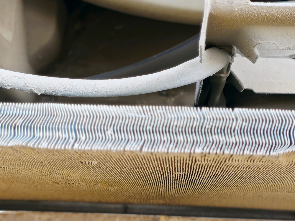 Dirty dusty condenser coil and the internal components of the outdoor air conditioning condenser unit, that undergoing routine cleaning and maintenance