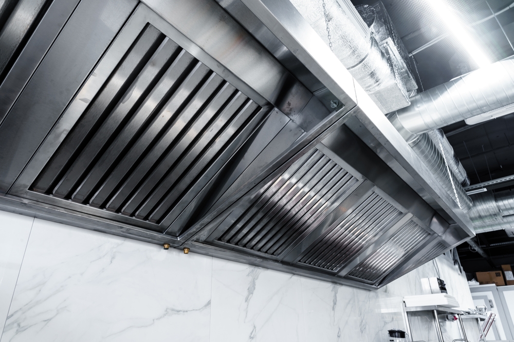 New clean stainless steel hood in professional kitchen